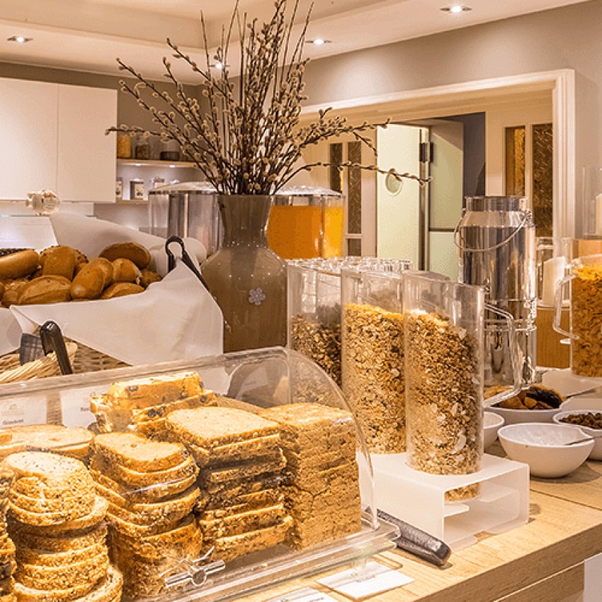View of the breakfast buffet with various breads and cereals