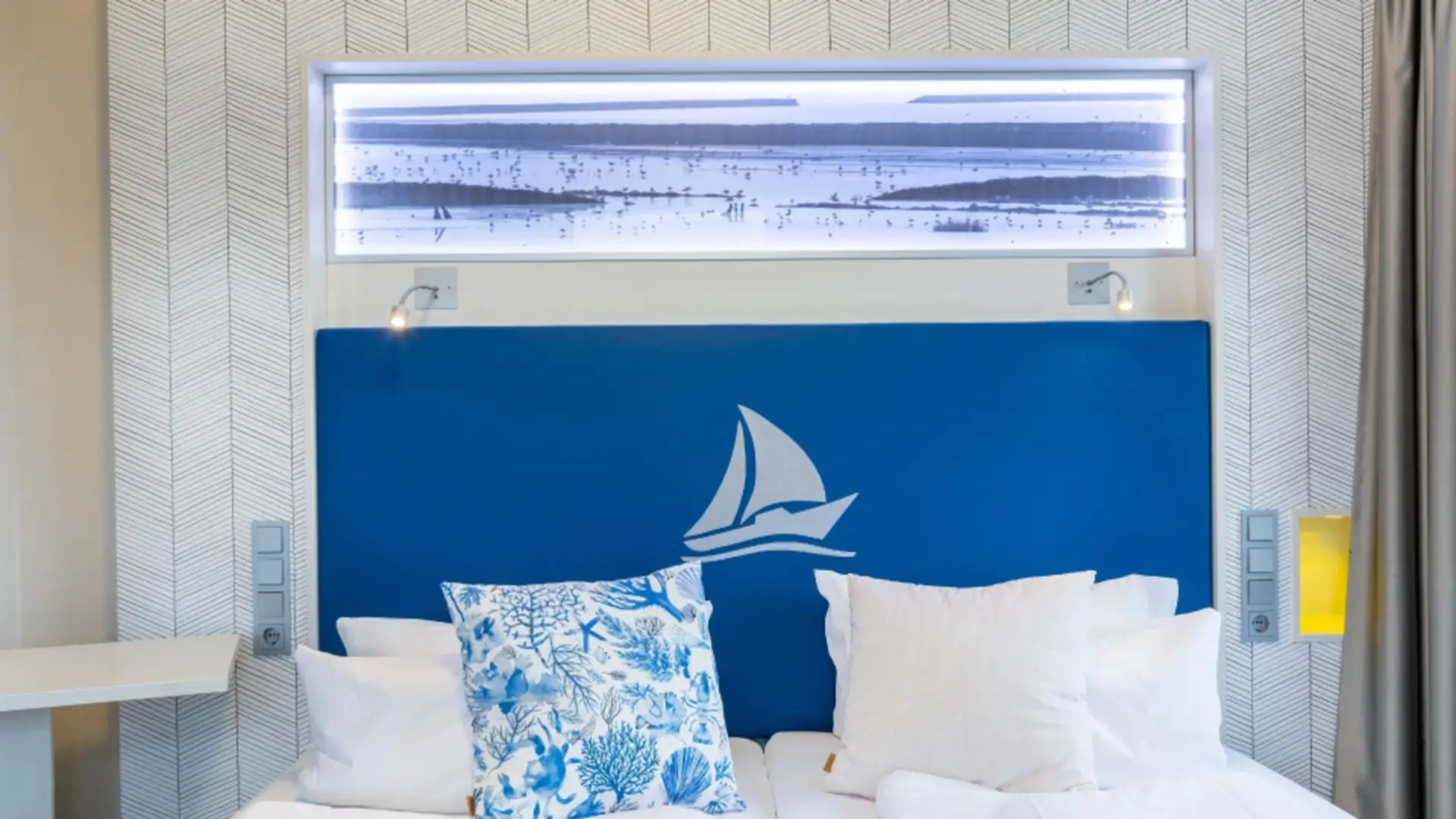 Bed view with Fährhaus logo