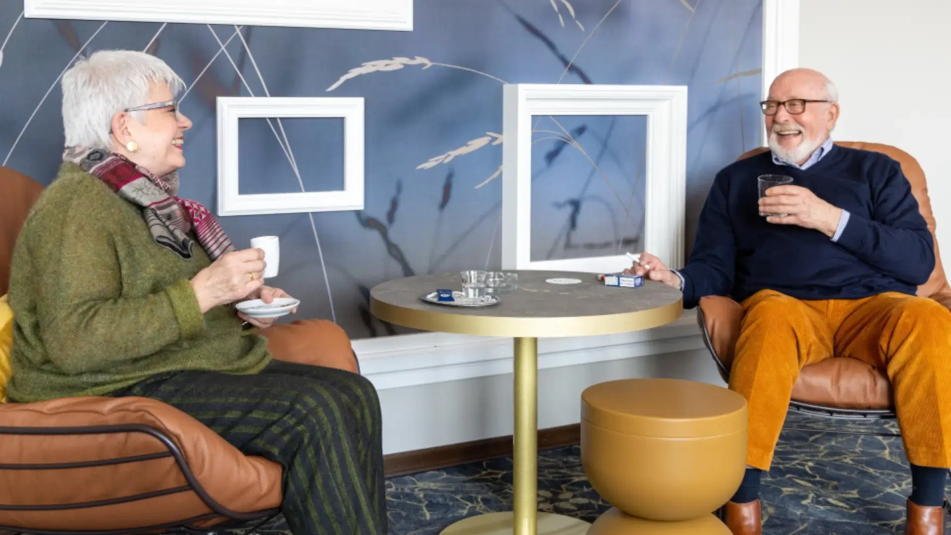 Couple enjoying a nightcap and a cigarette together