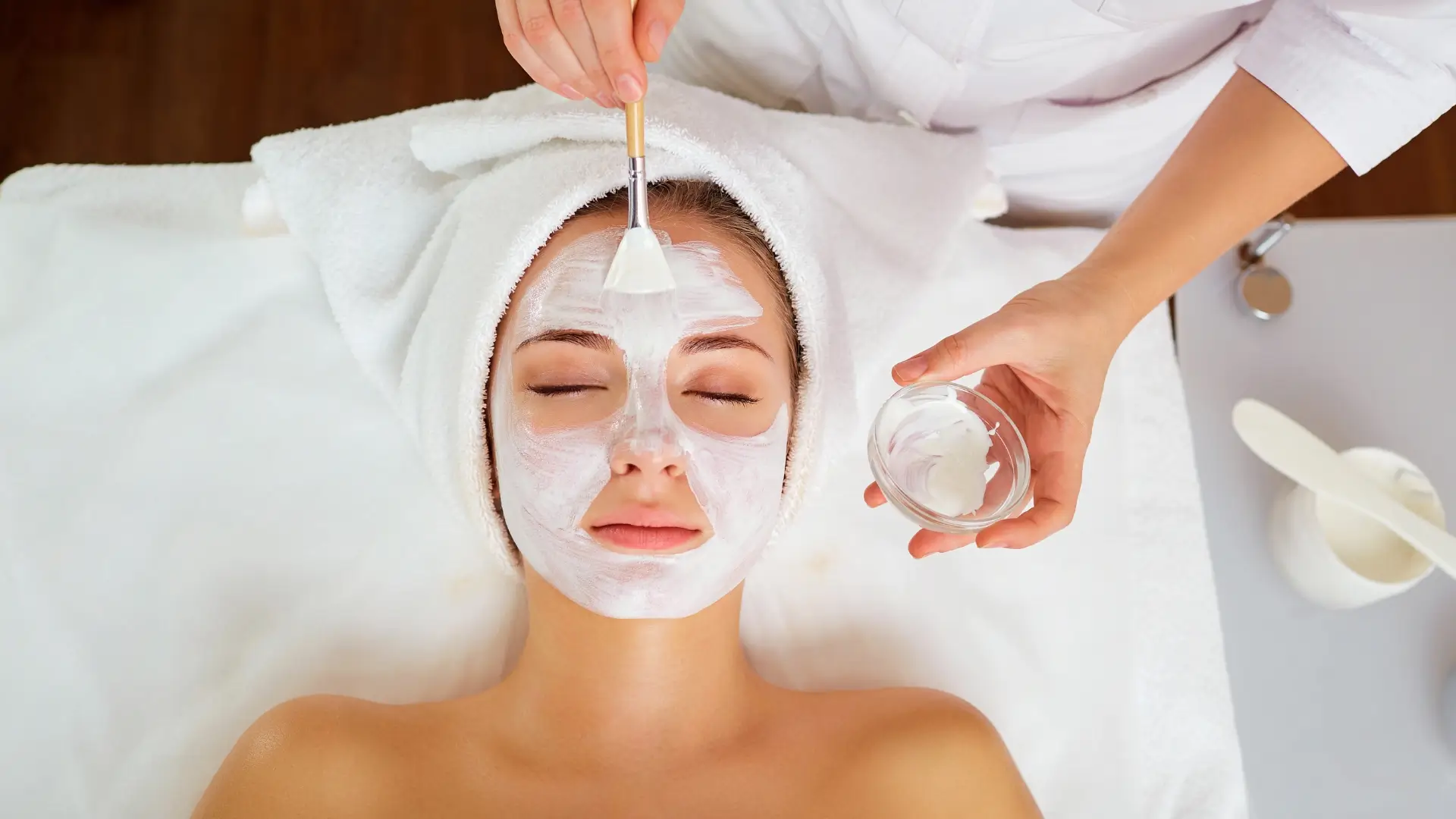 Woman receiving a facial treatment